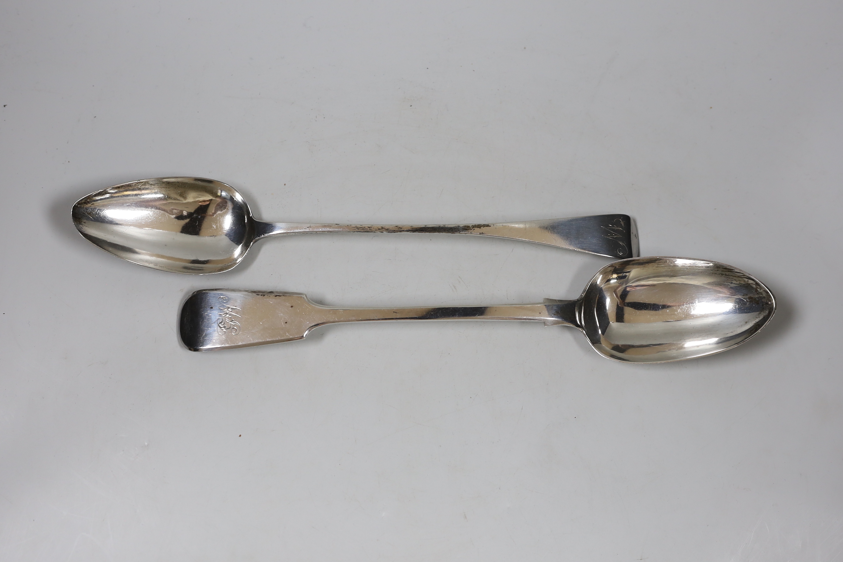 A George III Old English pattern basting spoon, London, 1811, 29.4cm and a later silver fiddle pattern basting spoon, London, 1859, 7.8oz.